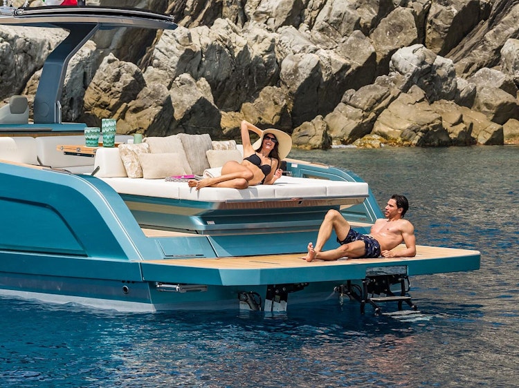 man laying on swim platform of pardo 43