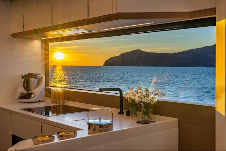 window near galley sink of ocean