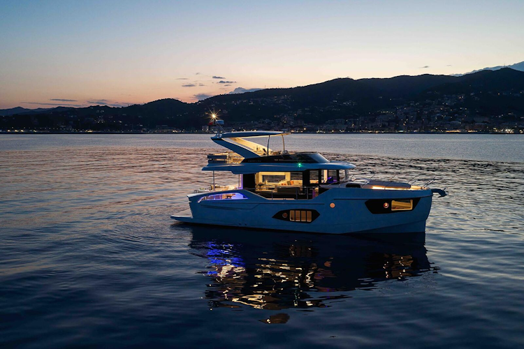 Navetta 50 at sunset with inside lights on
