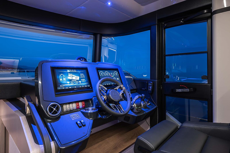 inside helm station lit up at night in navetta 50
