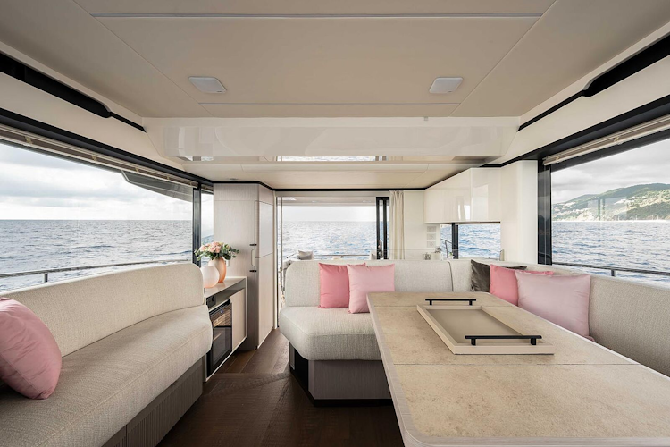 pink pillows on sofas in interior salon - navetta 50