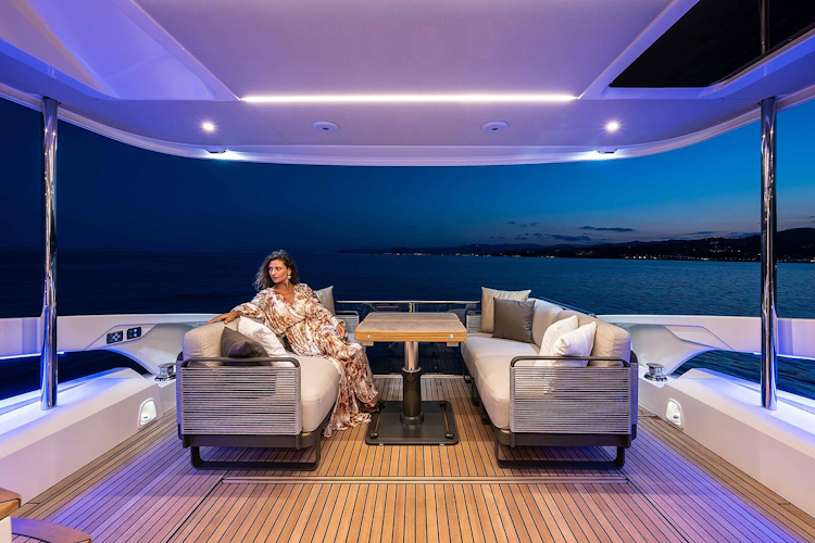 woman enjoying the well-lit cockpit in the evening