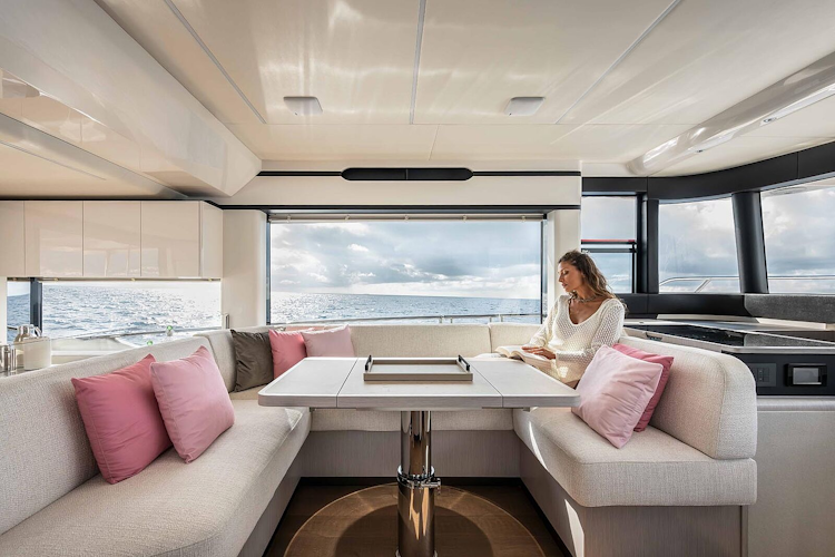 woman reading at dining table of navetta 50