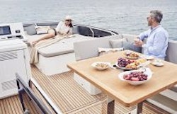 Prestige Yachts 520 Flybridge Dinette and adjacent seating sun pad