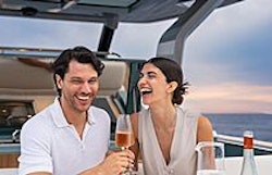 couple enjoying champagne on pardo 43