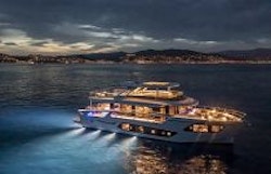 Navetta 75 in the evening with underwater lights