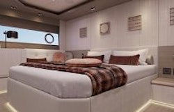 master cabin berth and window with portholes