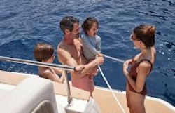family swimming off of the aft platform