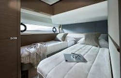 twin beds in third guest stateroom