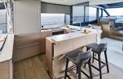 galley and bar with stools