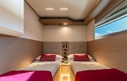side by side twin beds in third cabin