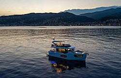 absolute navetta 50 at sunset with mountains in background