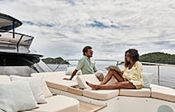 couple-relaxing-on-bow-sun-loungers-prestige-m7