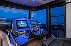 inside helm station lit up at night in navetta 50