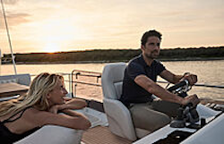 man driving from flybridge of prestige f4-3