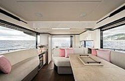 pink pillows on sofas in interior salon - navetta 50
