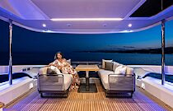 woman enjoying the well-lit cockpit in the evening