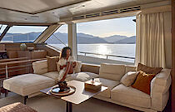 woman-reading-on-sofa-in-salon-prestige-m7