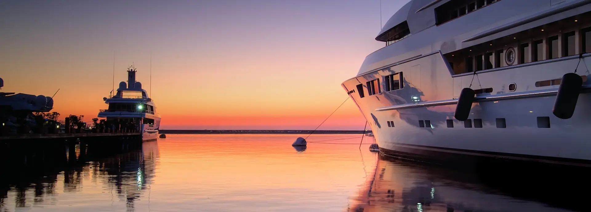 Yacht on the water at sunset.